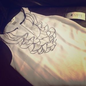 Cute sleeveless white and black blouse.