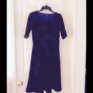 A blue floral dress in black with flare.