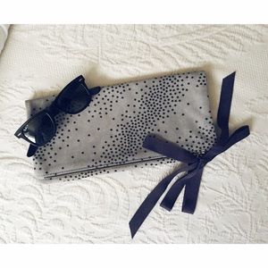 Clare V. folder over clutch.