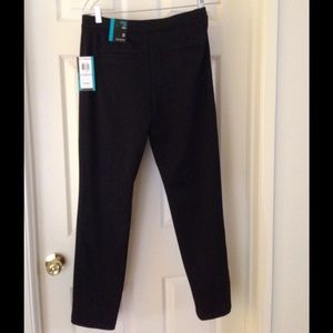 A black skinny leg mid-rise stretch pants.