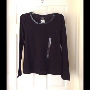 An elegant black blouse for casual evening wear.