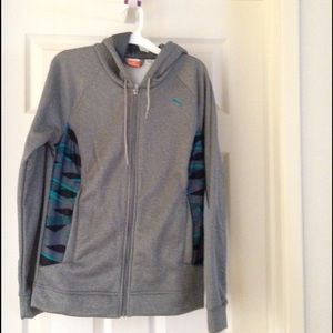 A grey sweat zipped jacket with a hood.