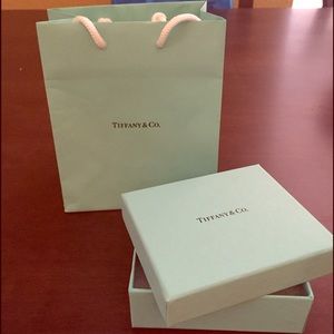 Authentic Tiffany & Co. gift box and bag.