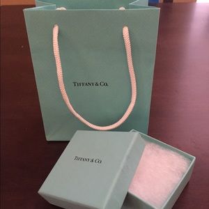 Authentic Tiffany & Co. gift box and bag.