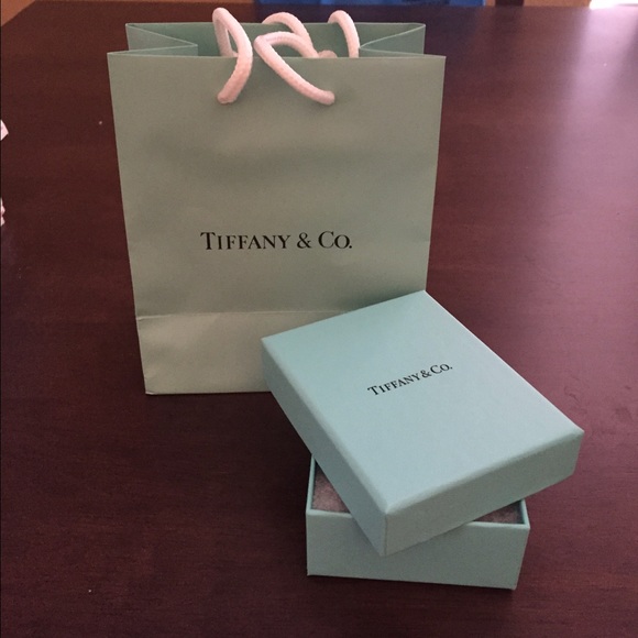 Authentic Tiffany & Co. gift box and bag.