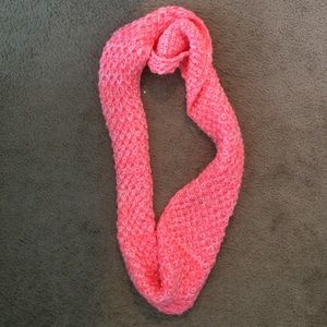 Hot pink knitted scarf.