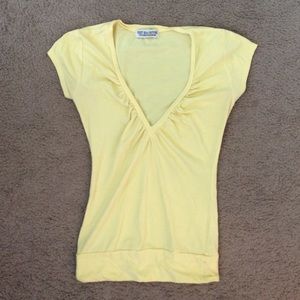 Yellow v-neck shirt