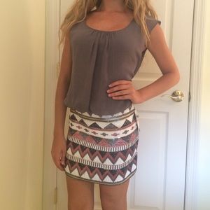 Dress with a sequined skirt and a sheer top