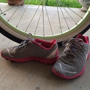 Pink, white and grey Nike FREE tennis shoes