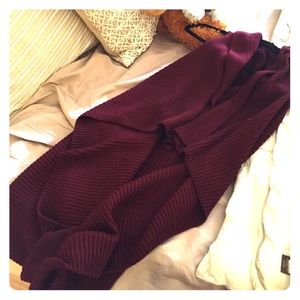 Long, red, knitted, sleeveless  cardigan