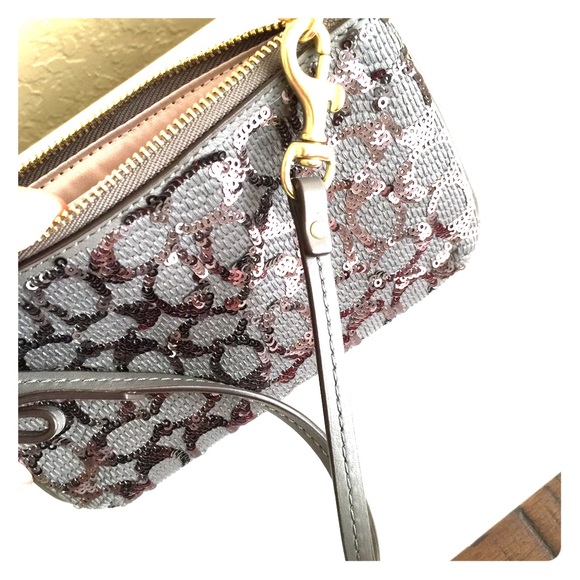 Unique Coach grey/silver sequin wristlet/wallet