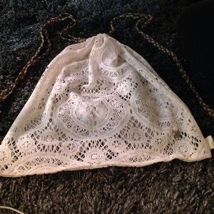 BKE White lace drawstring backpack.