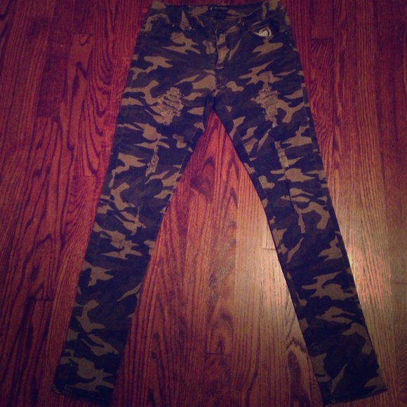 Distressed camouflage jeans