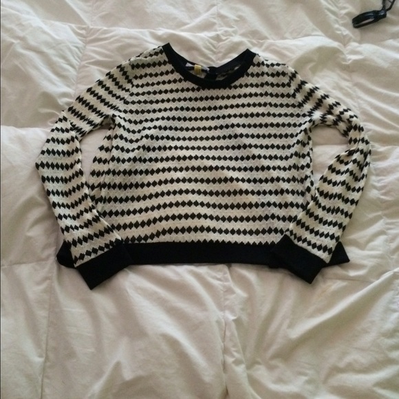 Cute diamond sweater opens in the back
