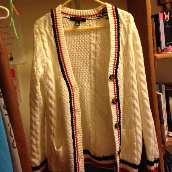White,knitted,and oversized cardigan.