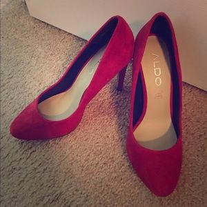 Red high-heeled shoes never worn