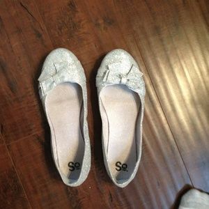 Silver sparkly flats with bows