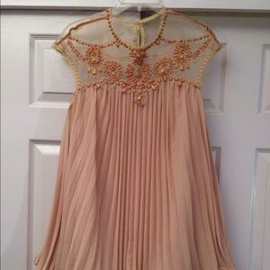 Nude colored short chiffon dress