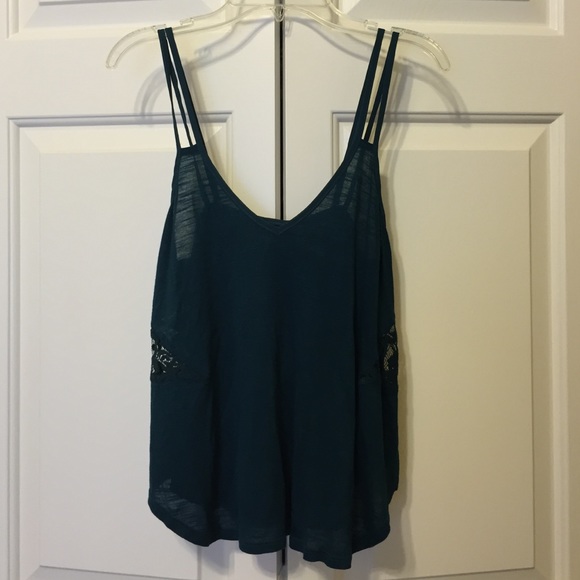 Teal sleeveless top with lace cutouts from UO