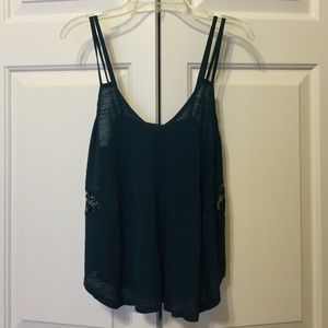 Teal sleeveless top with lace cutouts from UO