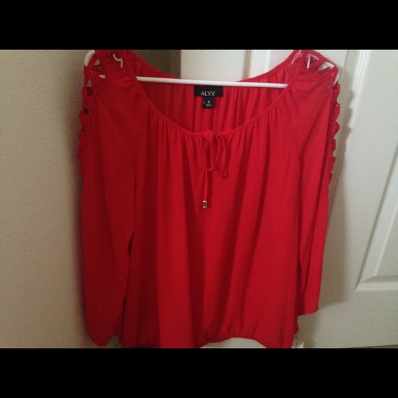 Beautiful red top with holes on the sleeves