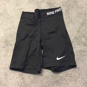 7 inch long black Nike pros