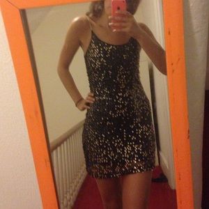 Black and gold sequin dress