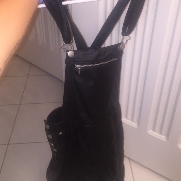 Black leather Bebe overalls. Never worn