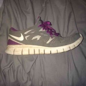 purple and gray Nike free run 2's