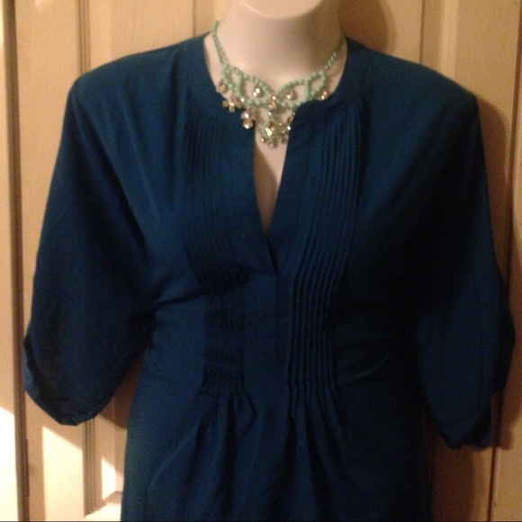 Dark teal silky top.