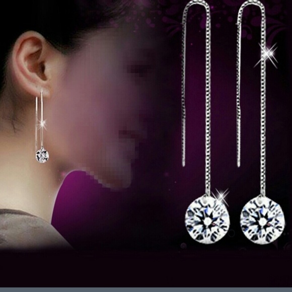 Long dropped silver earrings.W/CZ at end.
