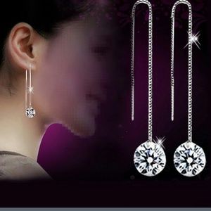 Long dropped silver earrings.W/CZ at end.