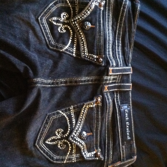 Beautiful pair of studded rock revival boot cuts