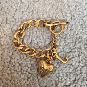 Gold juicy couture bracelet with case