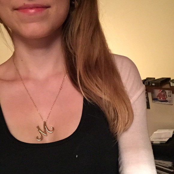 Gold necklace with "M" pendant