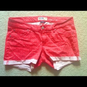 Salmon red and white polka-dotted low rise shorts