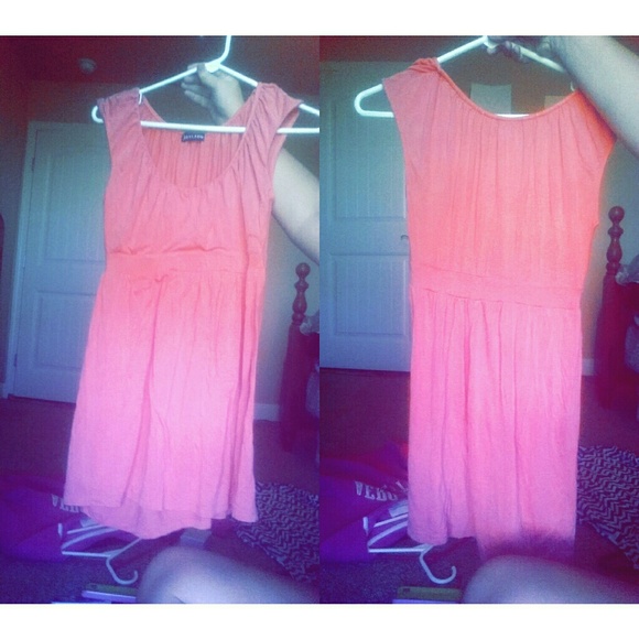 Mid thigh pink dress.