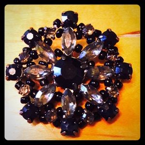Faux onyx and rhinestone brooch.