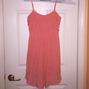 coral dress. with floral cut outs on the sides.