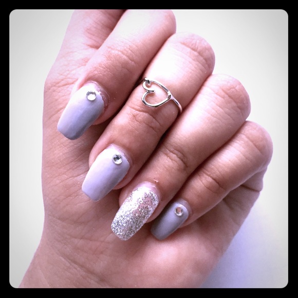 Closed heart knuckle ring