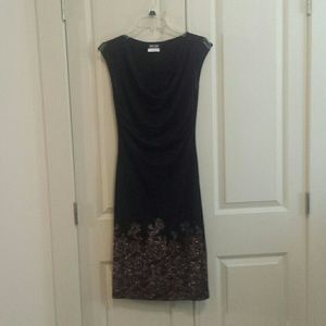 Black cocktail dress with gold design