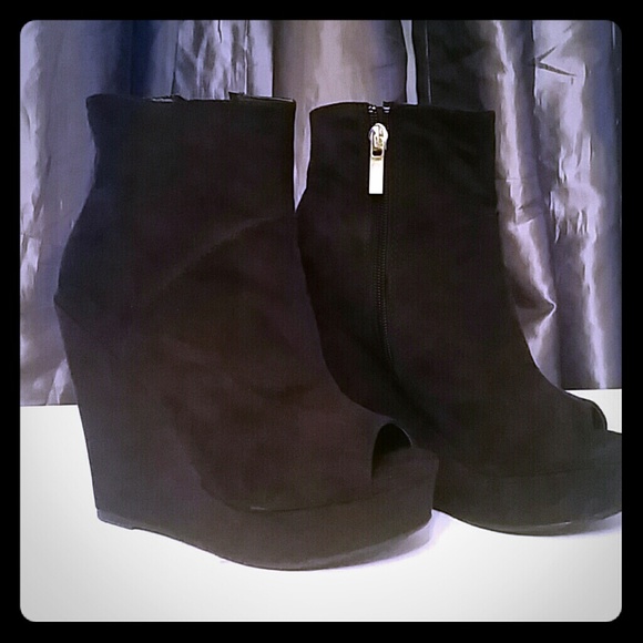Black peep toe wedge ankle boots.