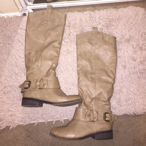 Tan-colored knee high boots