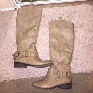 Tan-colored knee high boots