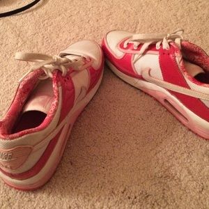 Red, pink and white Nike shoes
