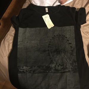 Carnival theme shirt. Has pockets on the sides