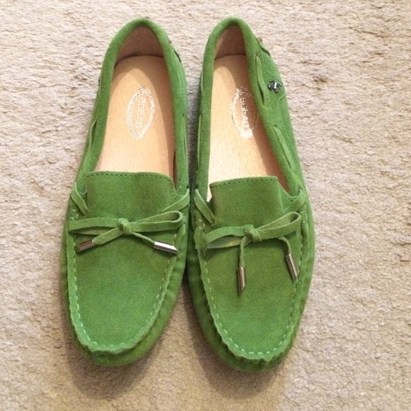 Green suede loafers with leather lining.