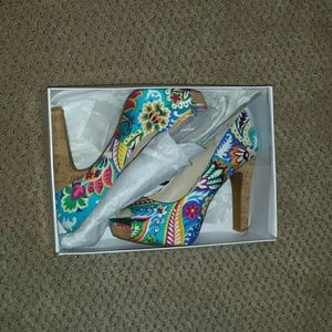 Nine West peep toe floral pumps.
