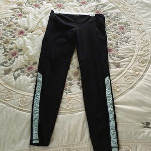 Yoga pants with blue stripe.