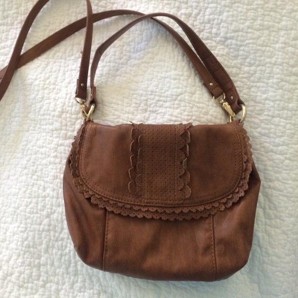 Light brown cross body purse.